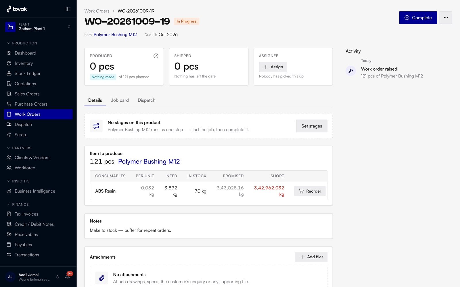 A Tovak work order: produced and shipped counts, an assignee slot, and the material it needs against what's in stock, with the shortfall in red and a Reorder button